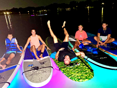Fu family bonding evening on paddle glow boards